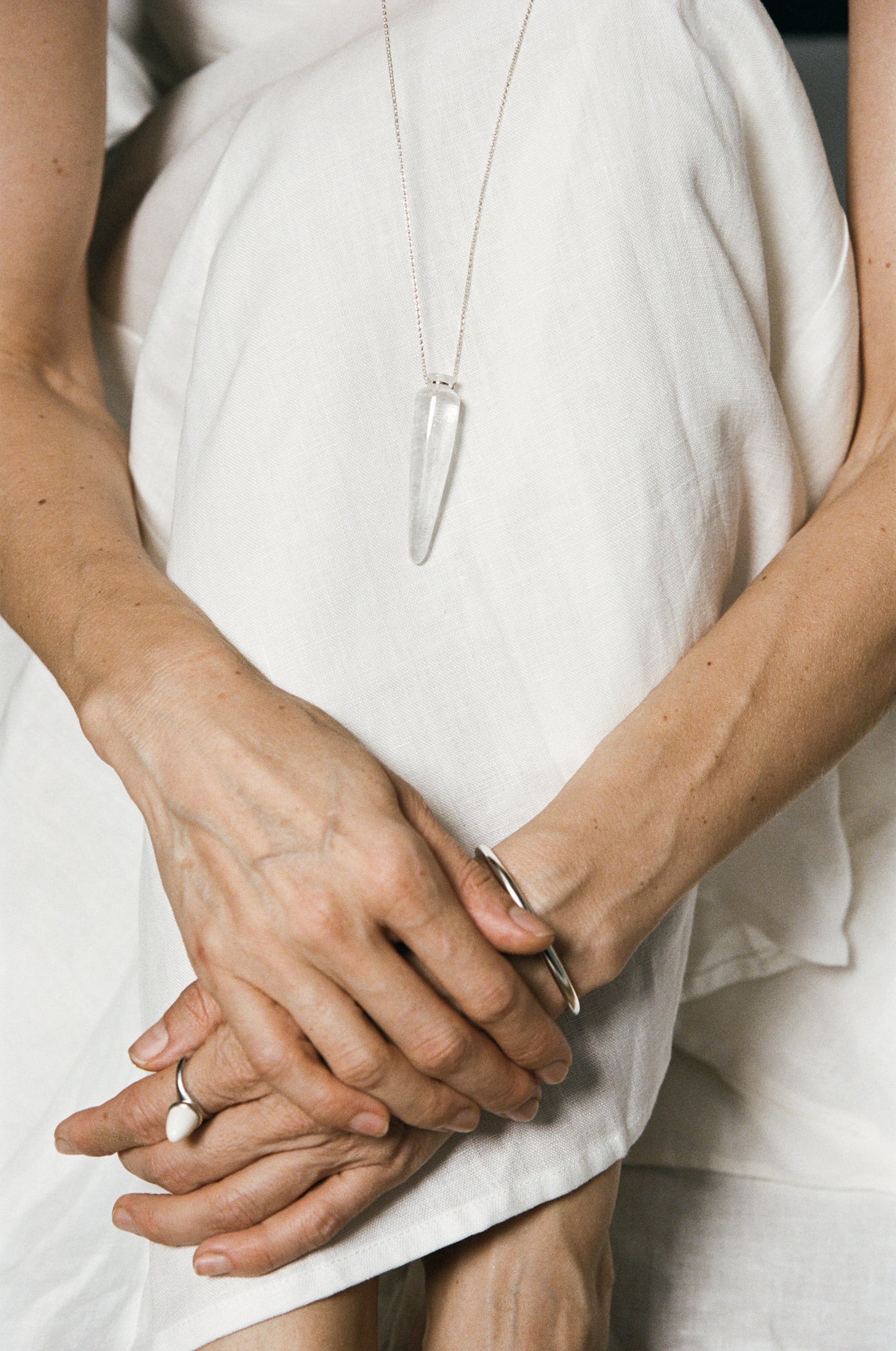 RIVERLAKE Phial of Light Pendant featuring a clear quartz crystal with intricate silver detailing.