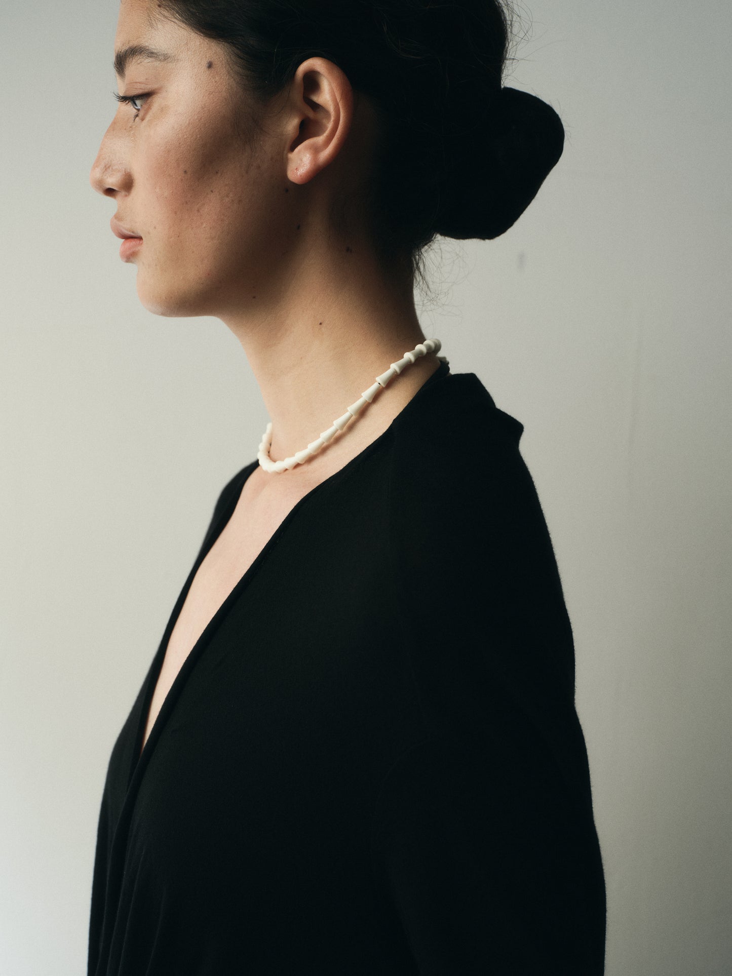 RIVERLAKE Simple Cone Necklace featuring an antler design, elegantly hanging on a delicate chain against a neutral background.