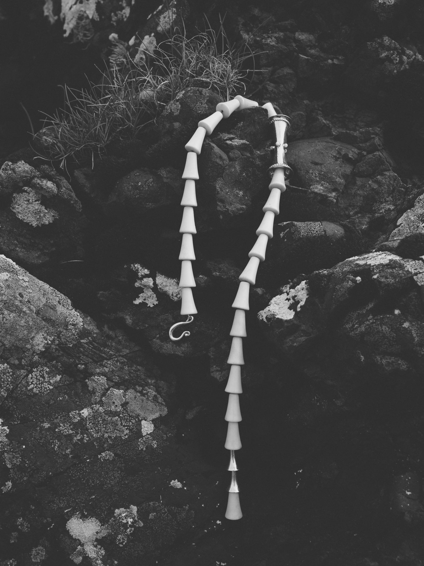 Antler cone necklace by RIVERLAKE, showcasing a unique design with natural textures and earthy tones.