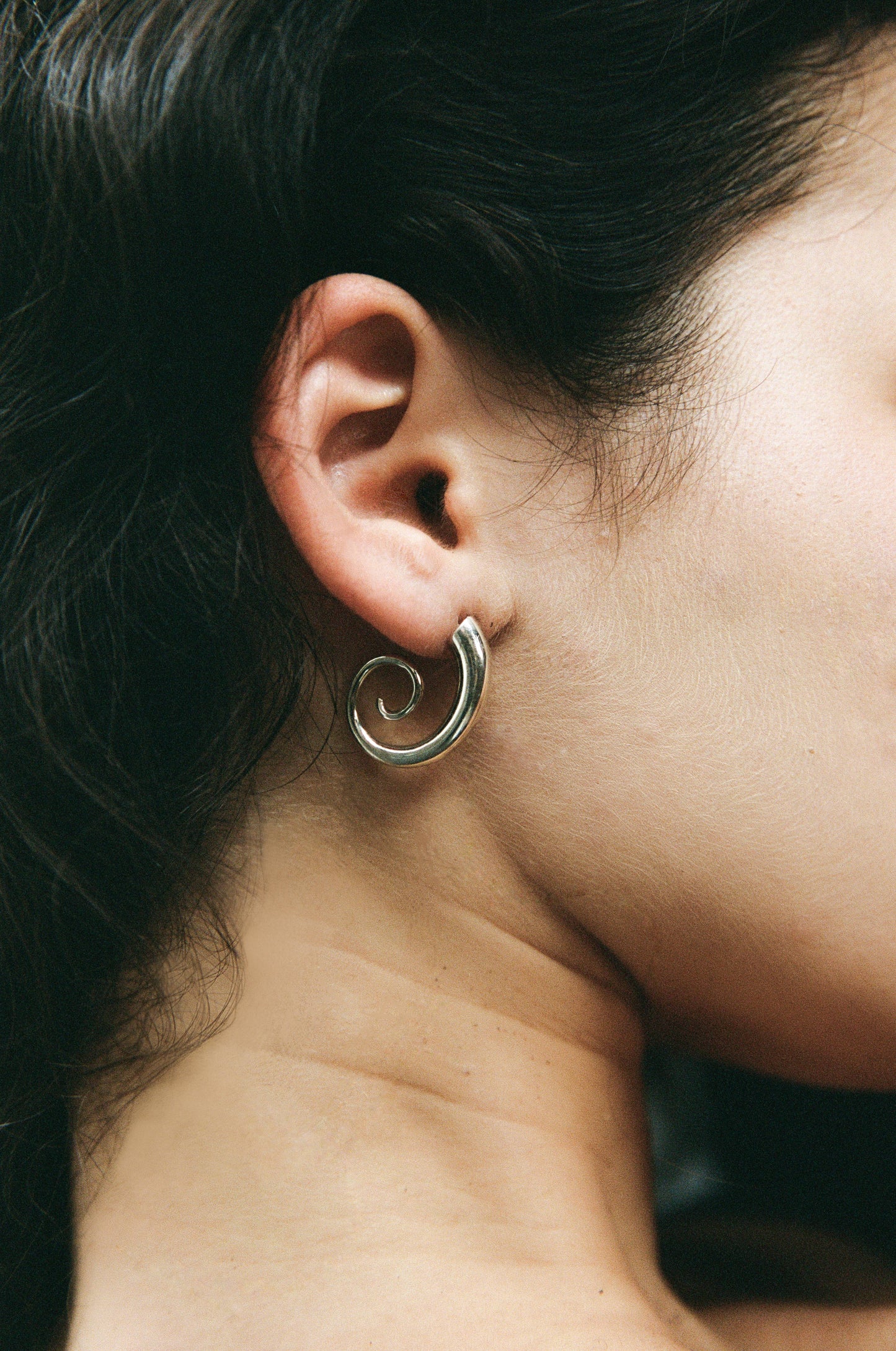 RIVERLAKE snail earrings featuring a whimsical design with intricate detailing and a shiny finish.