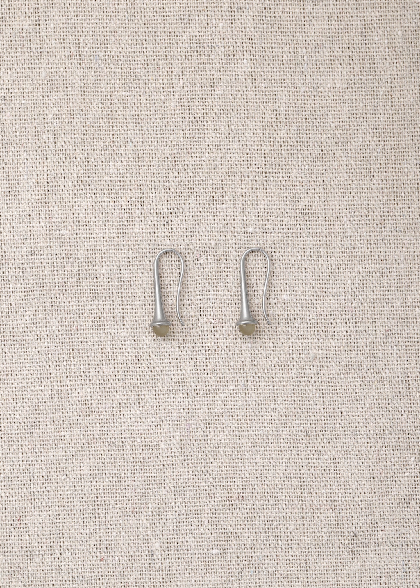 Lilt earrings made from sheep horn by RIVERLAKE, featuring a unique and elegant design.