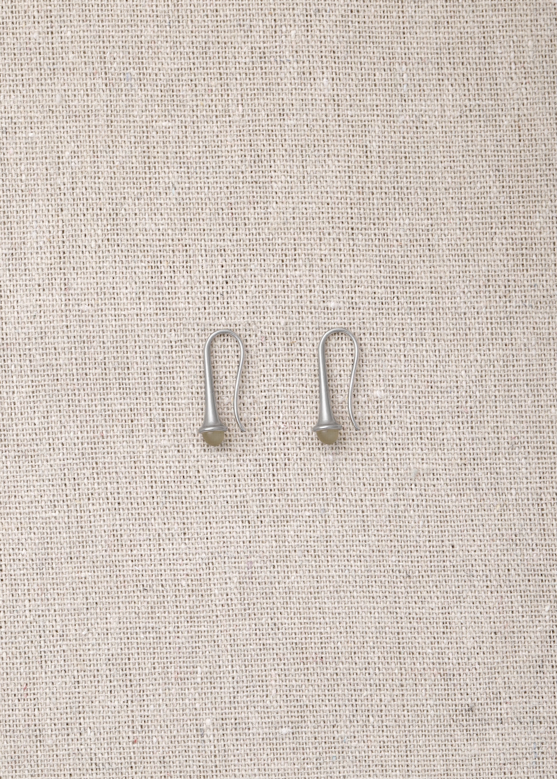 Lilt earrings made from sheep horn by RIVERLAKE, featuring a unique and elegant design.