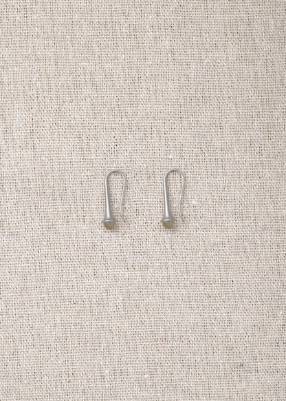 Lilt earrings made from sheep horn by RIVERLAKE, featuring a unique and elegant design.