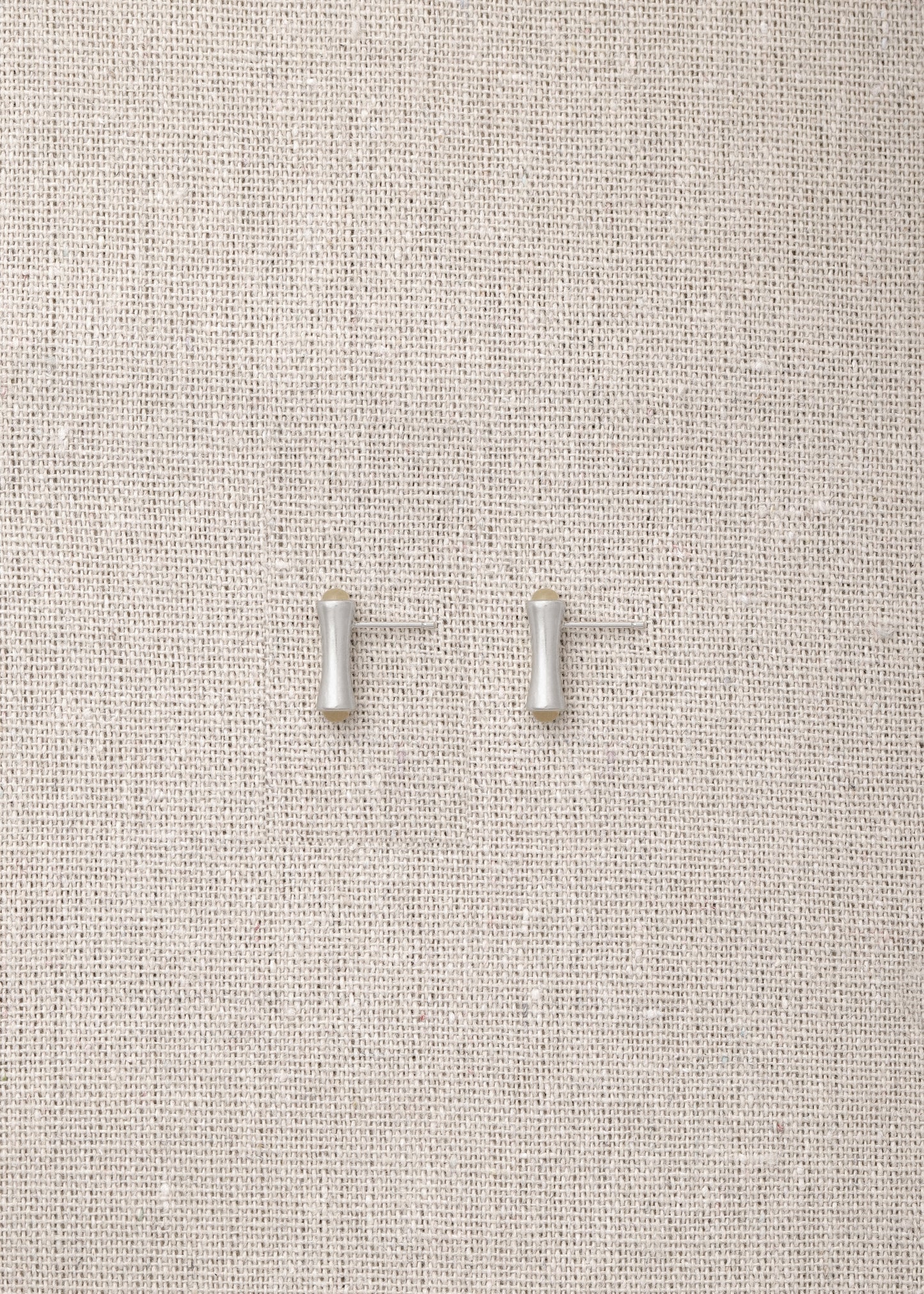 Cove Studs made from natural sheep horn by RIVERLAKE, showcasing a unique, organic design perfect for any outfit.