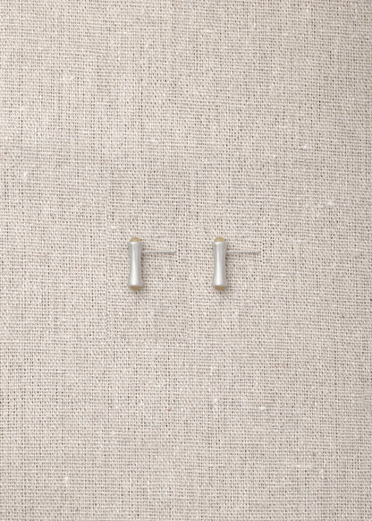 Cove Studs made from natural sheep horn by RIVERLAKE, showcasing a unique, organic design perfect for any outfit.