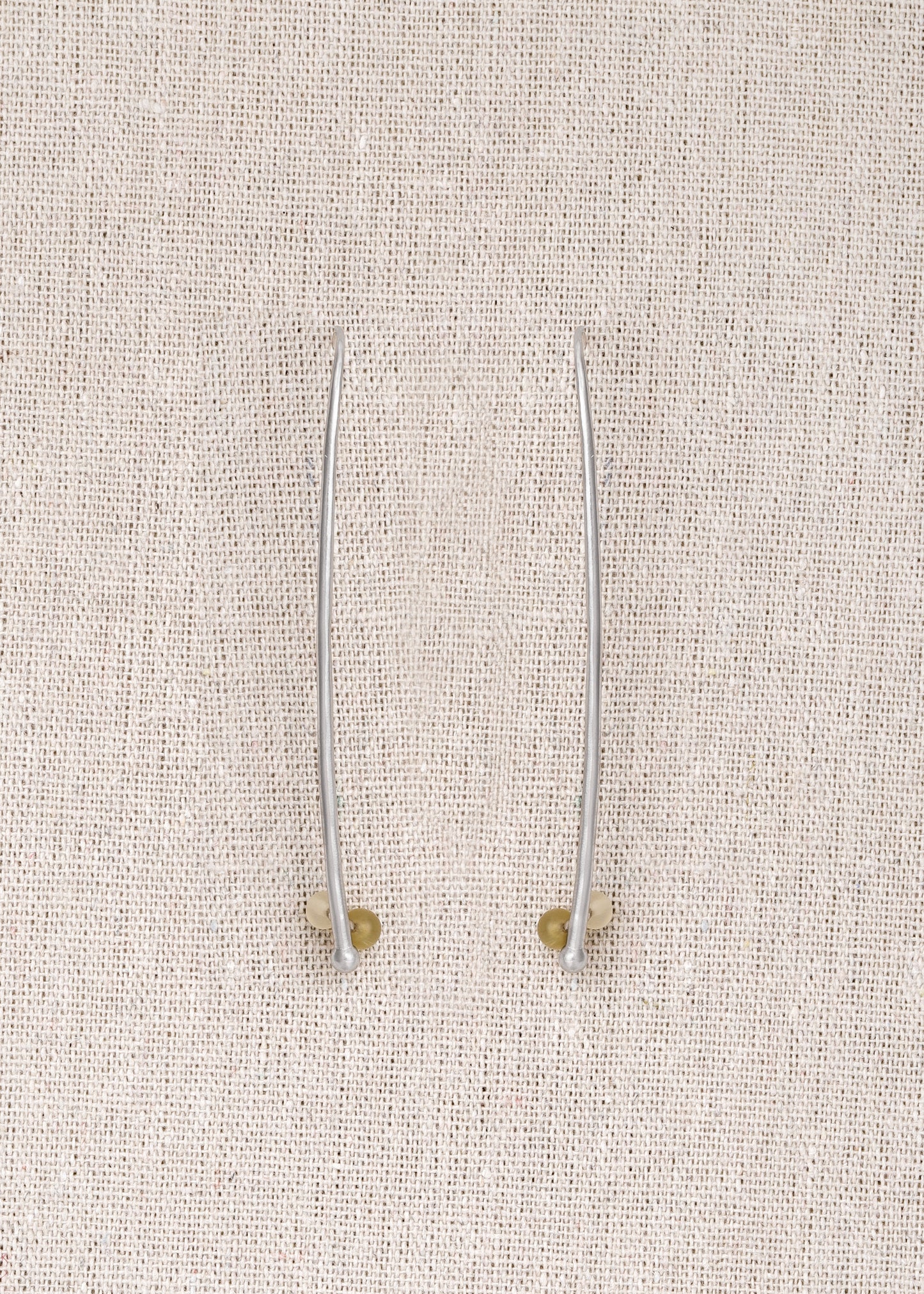RIVERLAKE Long Branch Earrings crafted from sheep horn, showcasing a unique, natural design with elegant curves.