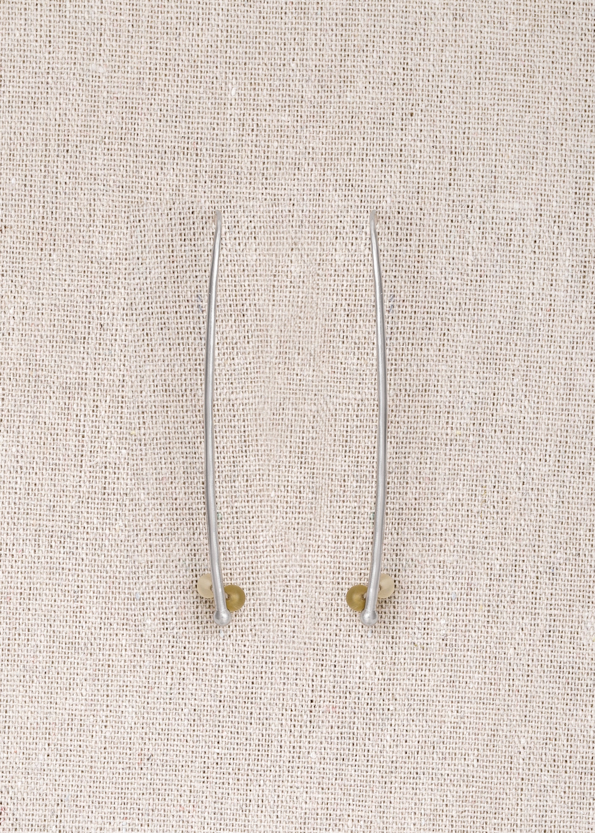 RIVERLAKE Long Branch Earrings crafted from sheep horn, showcasing a unique, natural design with elegant curves.