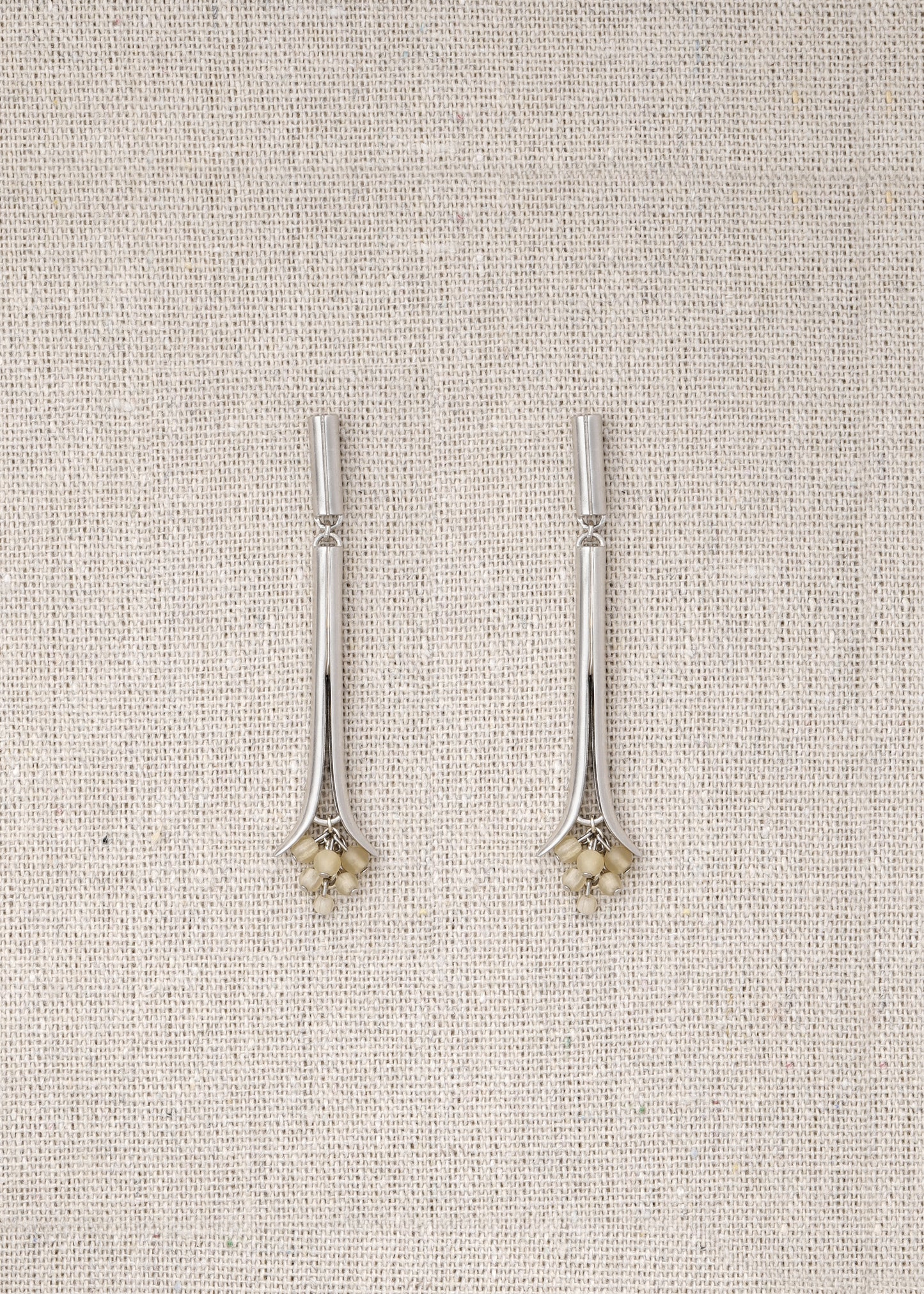 RIVERLAKE Oasis Earrings crafted from sheep horn, featuring a unique, organic shape and earthy tones.