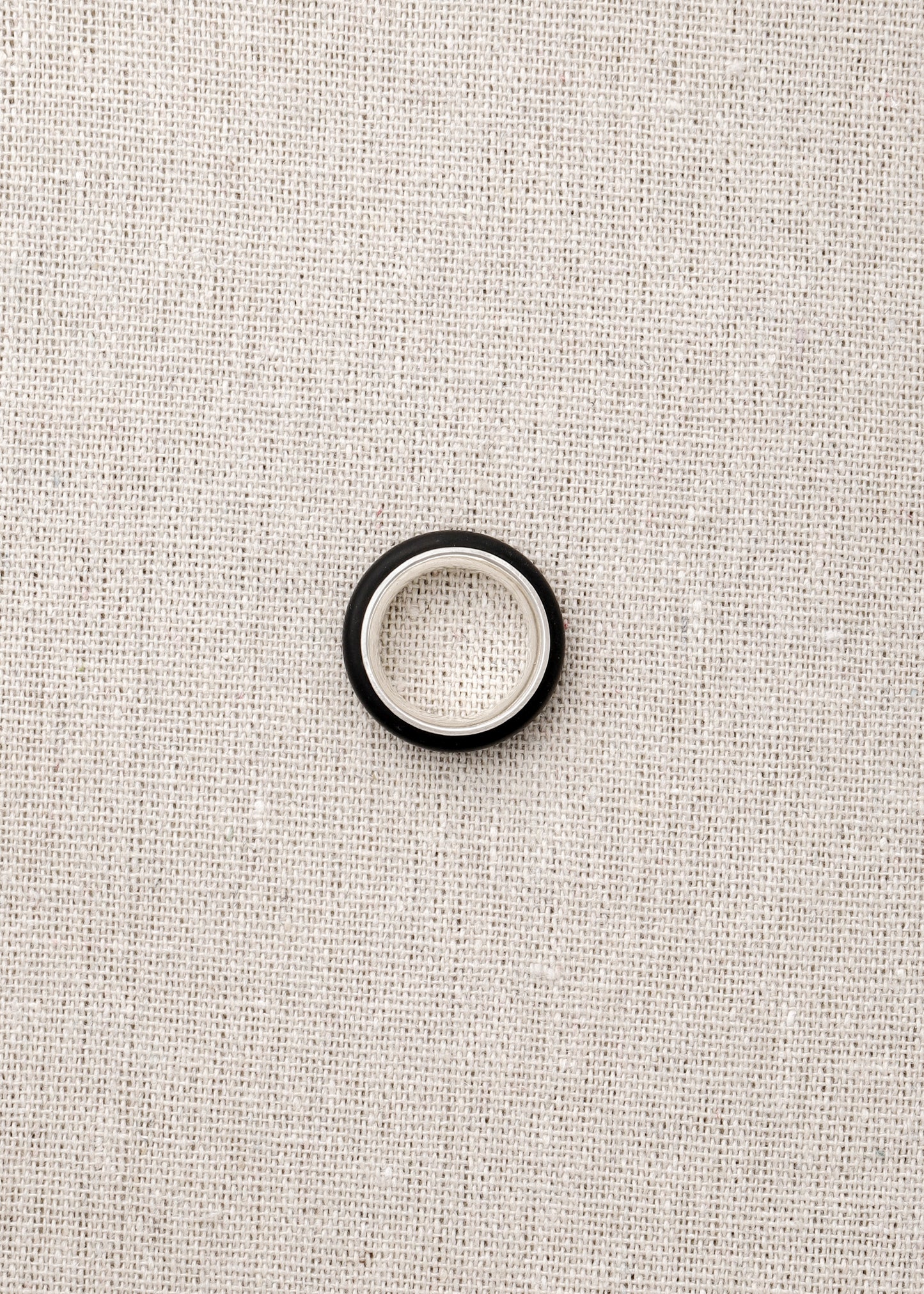 Black Buffalo Horn Karma Ring by RIVERLAKE, showcasing a smooth, polished finish and unique natural grain patterns.