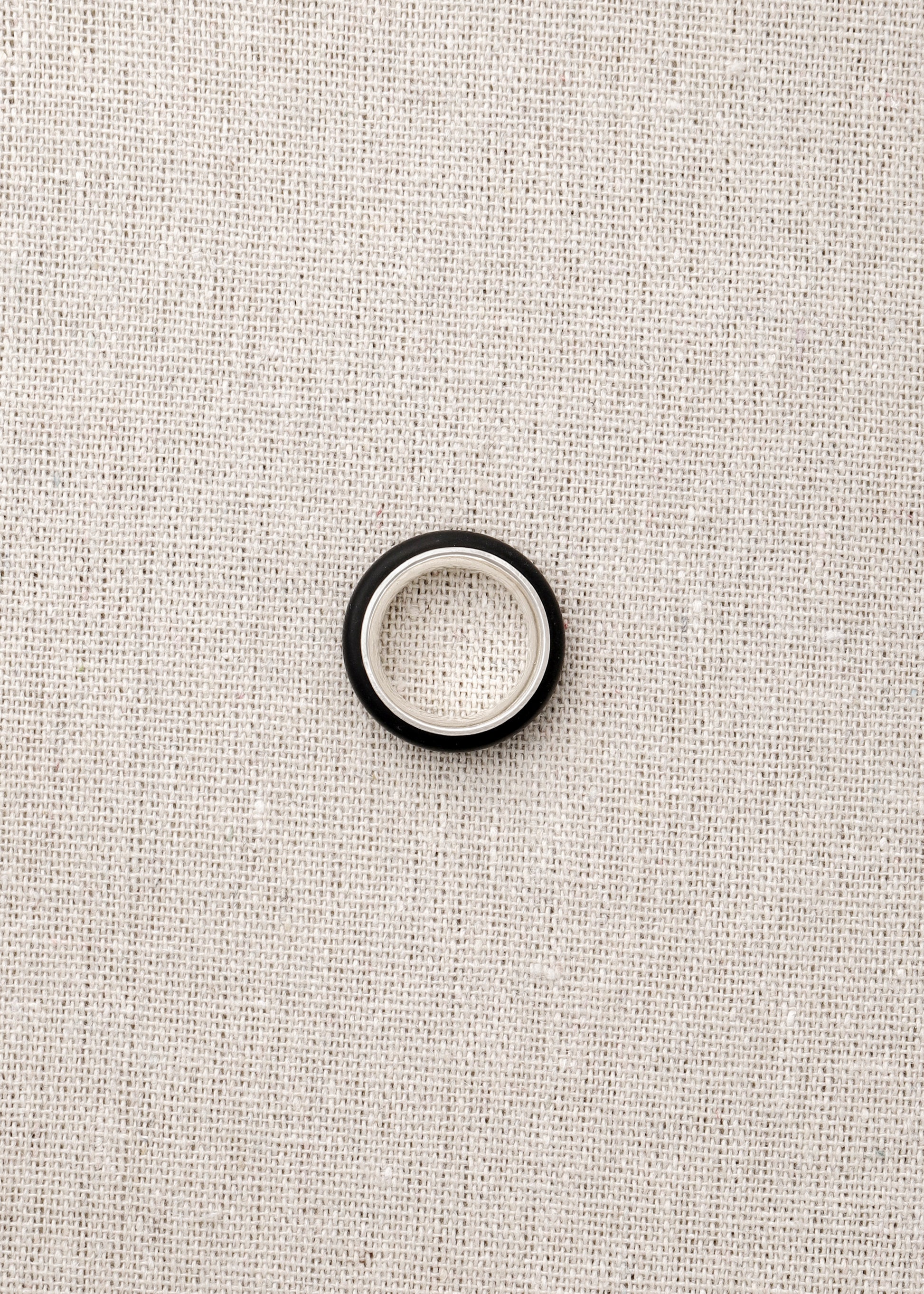 Black Buffalo Horn Karma Ring by RIVERLAKE, showcasing a smooth, polished finish and unique natural grain patterns.