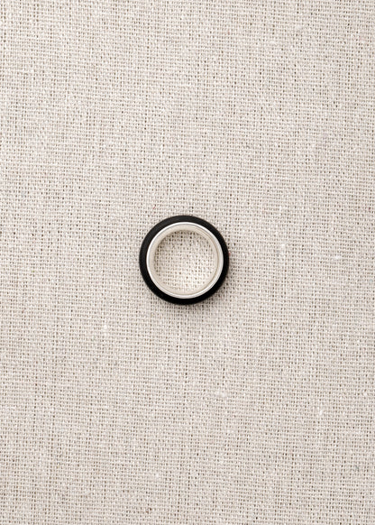 Black Buffalo Horn Karma Ring by RIVERLAKE, showcasing a smooth, polished finish and unique natural grain patterns.
