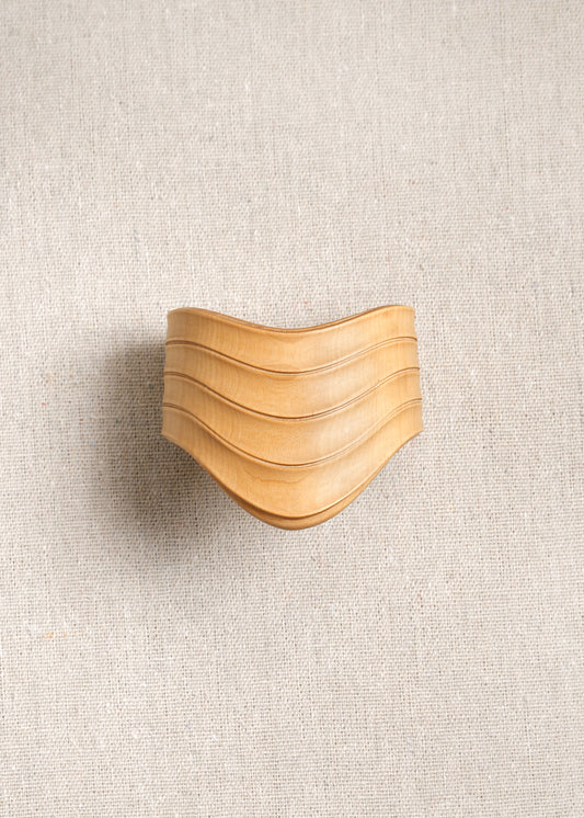 RIVERLAKE Drape Cuff in Boxwood showcasing a textured green fabric with elegant draping detail.