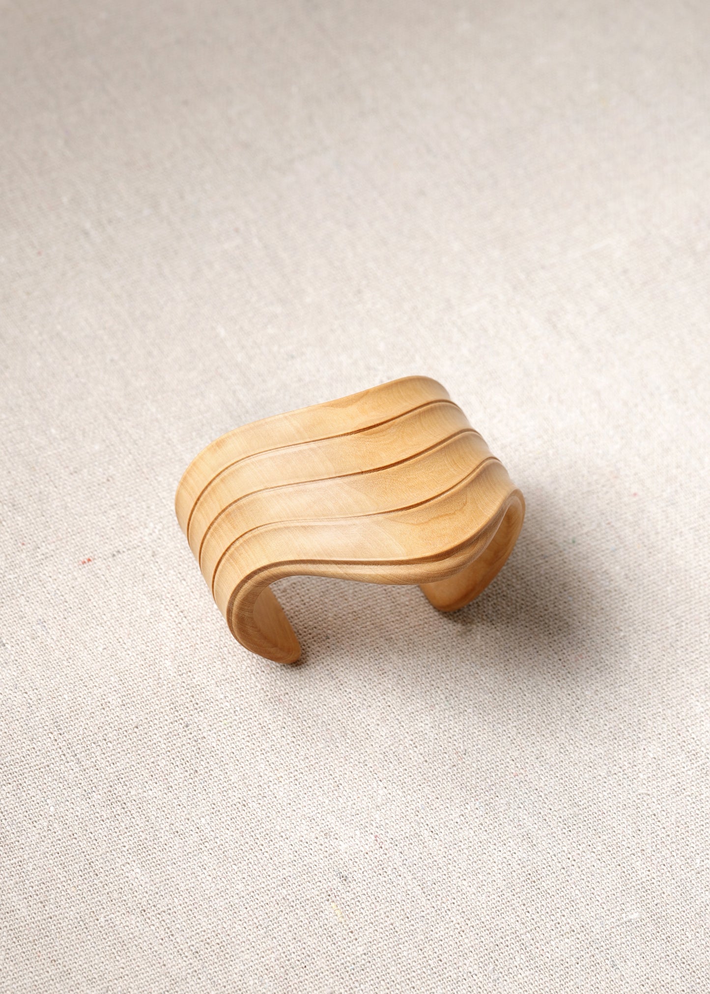 RIVERLAKE Boxwood Drape Cuff showcasing elegant fabric draping and stylish cuff design in a rich green color.
