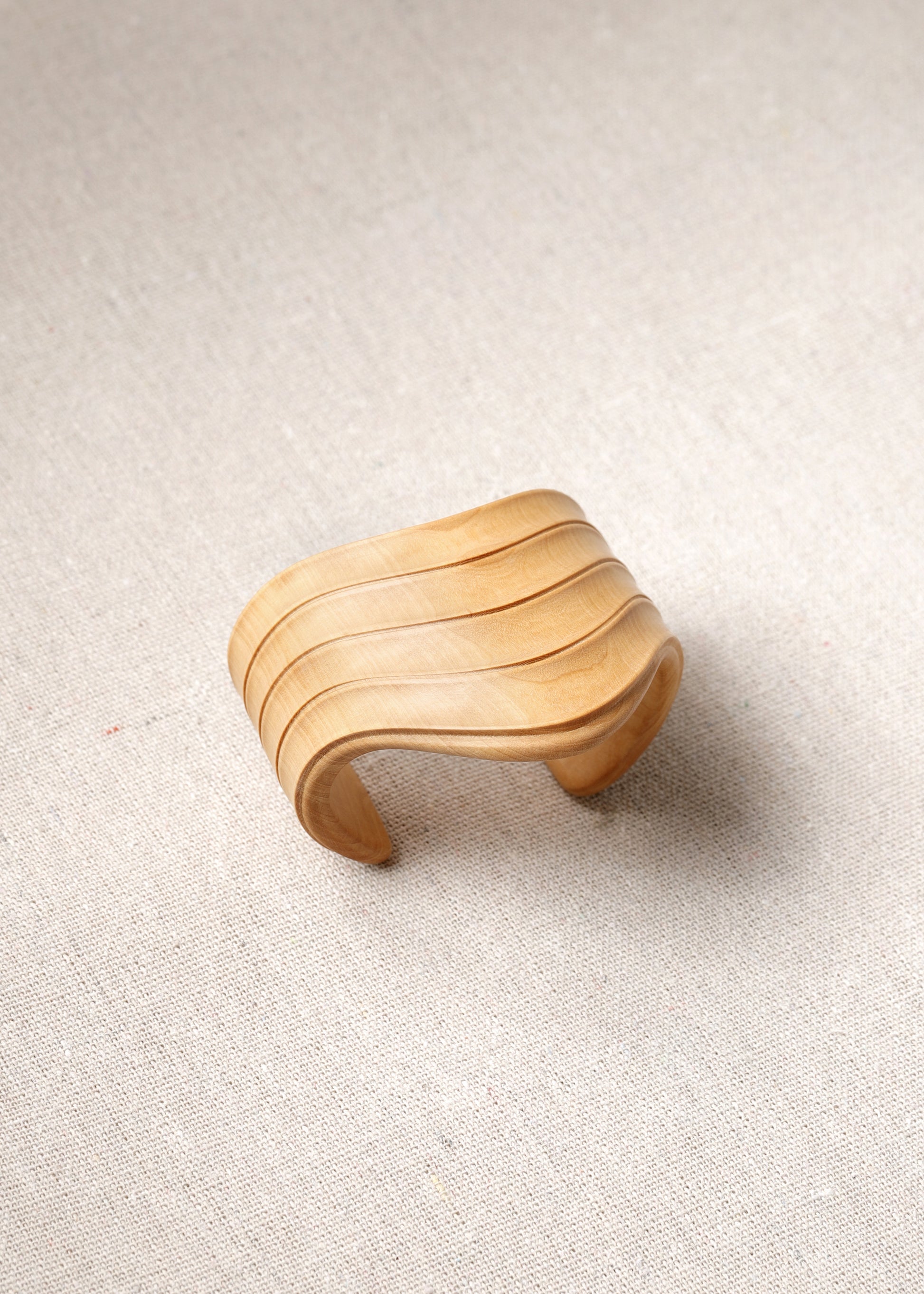 RIVERLAKE Boxwood Drape Cuff showcasing elegant fabric draping and stylish cuff design in a rich green color.