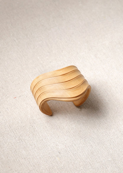 RIVERLAKE Boxwood Drape Cuff showcasing elegant fabric draping and stylish cuff design in a rich green color.
