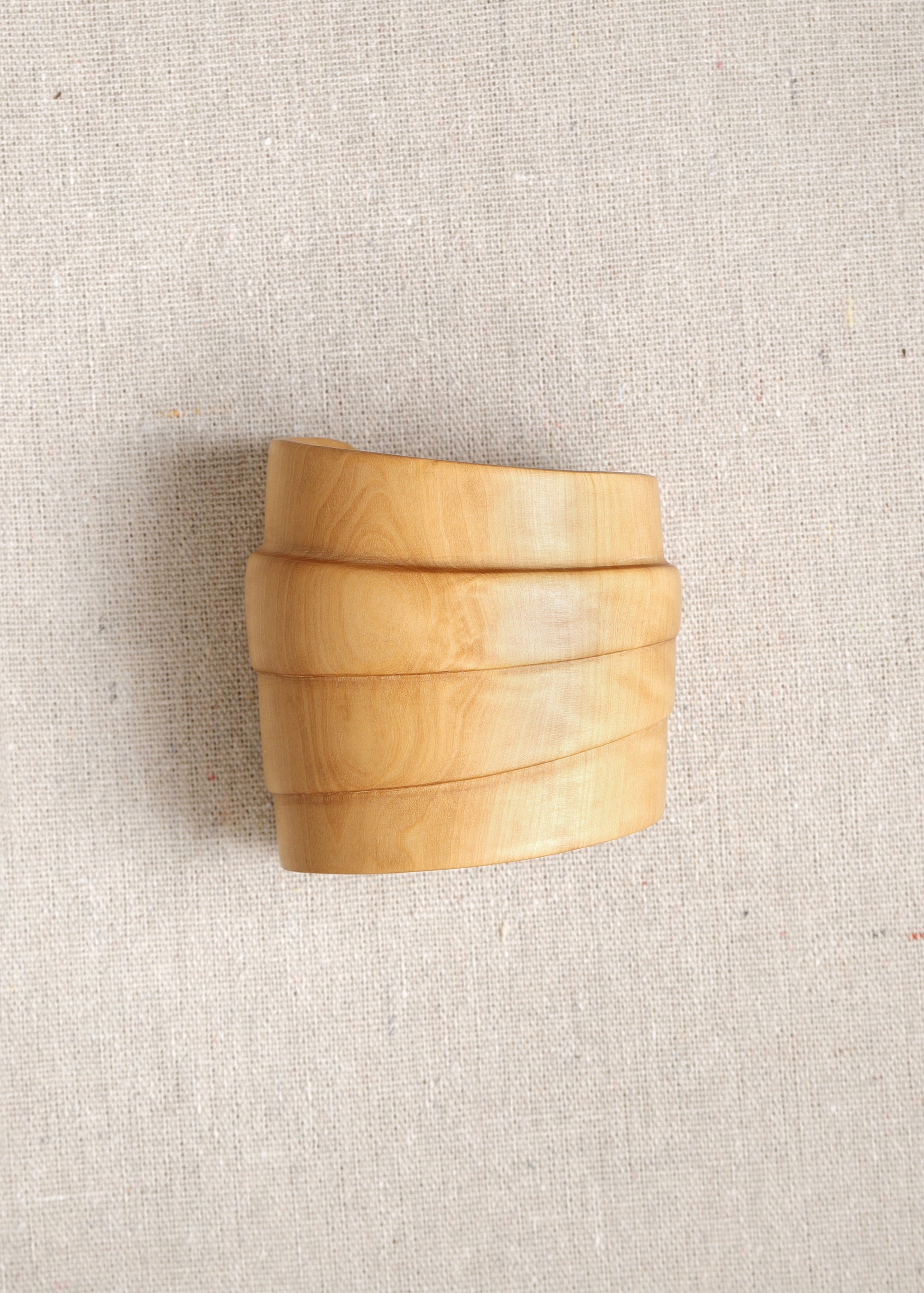 RIVERLAKE Strata Cuff in Boxwood, showcasing a sleek, modern design with a vibrant green hue and textured finish.