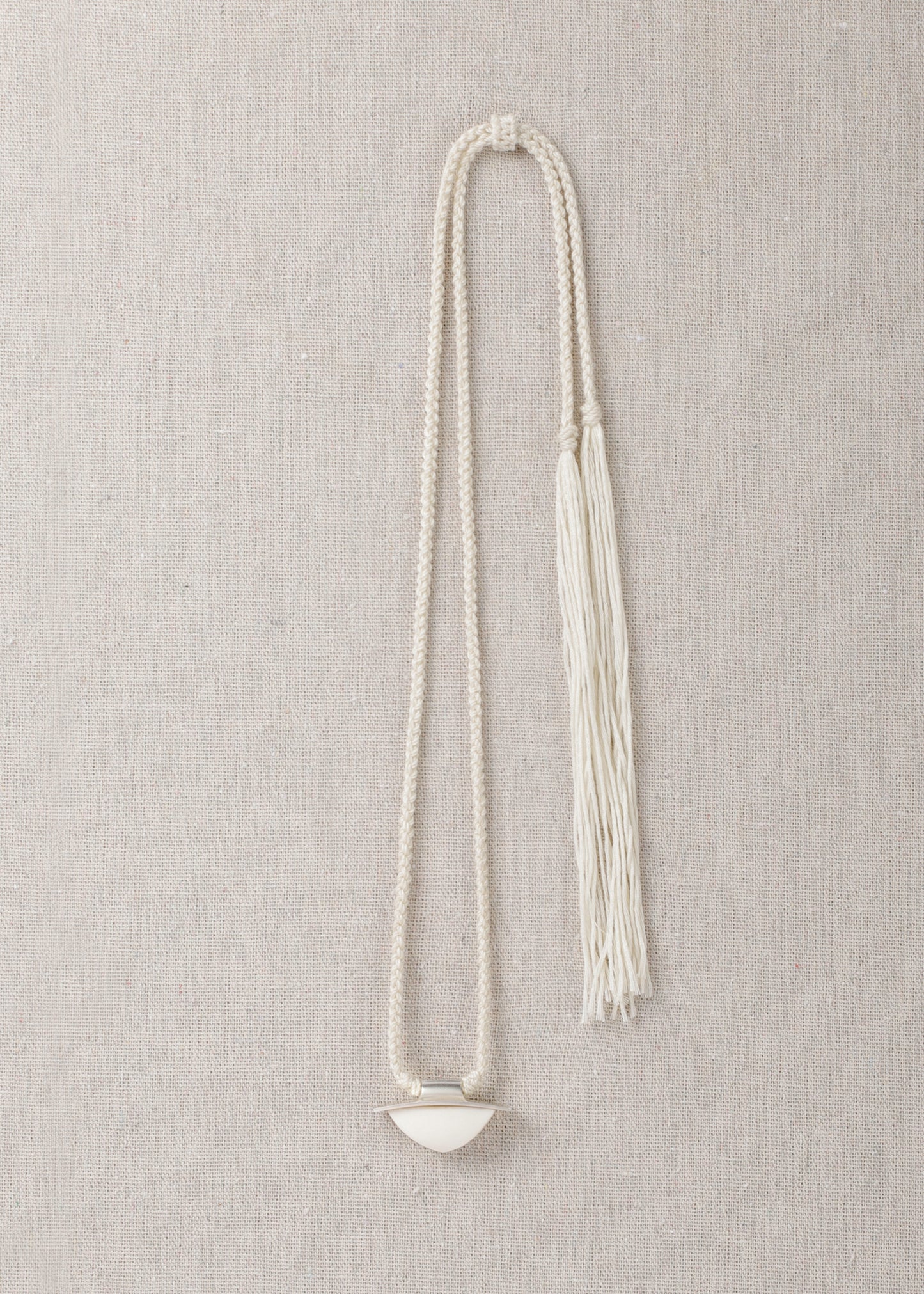 RIVERLAKE spade pendant crafted from antler with intricate detailing and a natural finish.
