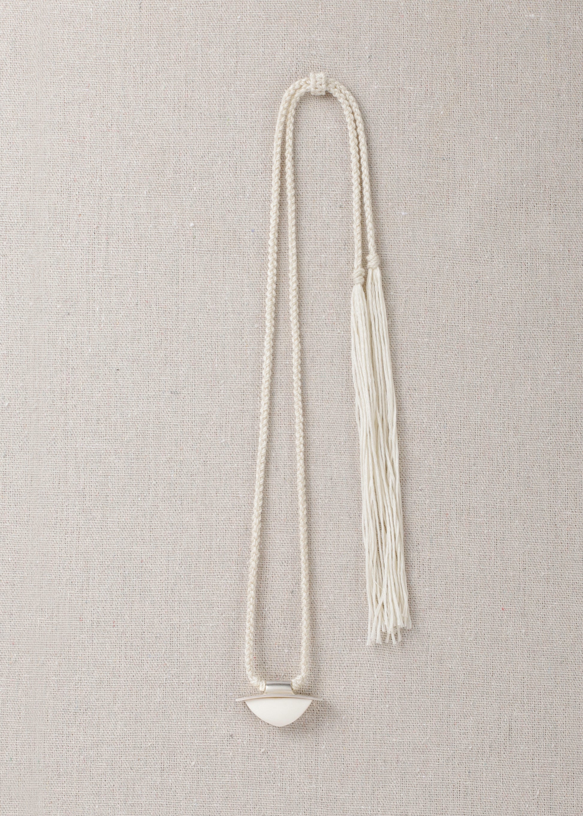 RIVERLAKE spade pendant crafted from antler with intricate detailing and a natural finish.