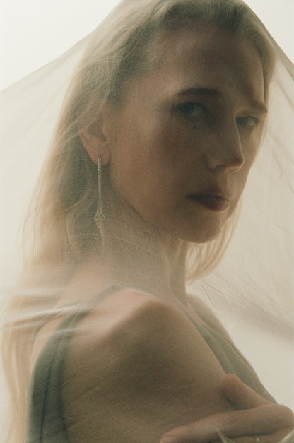 Oasis earrings by RIVERLAKE crafted from natural sheep horn, featuring unique shapes and earthy tones.