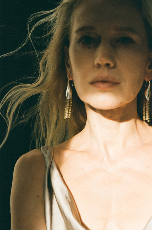 Petal earrings crafted from sheep horn, featuring a unique design by RIVERLAKE.