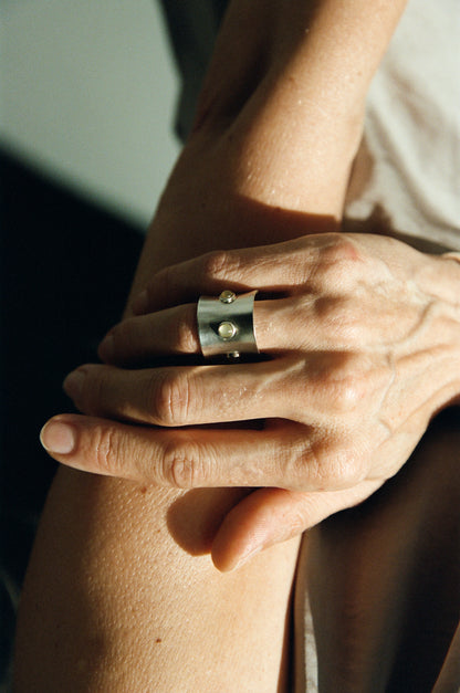 Black buffalo horn pupil ring by RIVERLAKE, showcasing a smooth, circular design with a glossy finish.