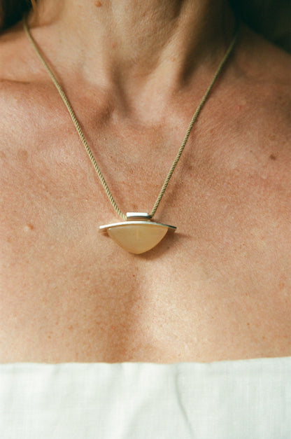 RIVERLAKE spade pendant crafted from sheep horn, showcasing a unique design and natural texture.