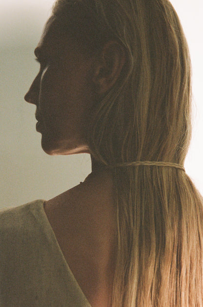 Silver crescent necklace by RIVERLAKE with a delicate chain and minimalist design, showcasing a polished crescent pendant.