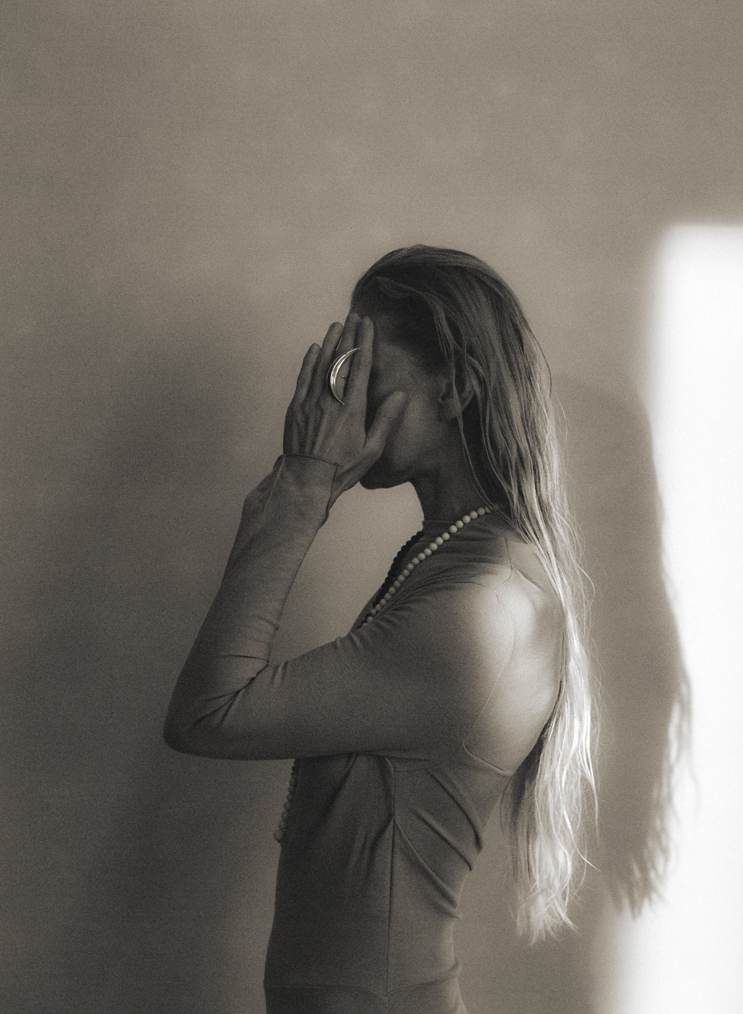 RIVERLAKE moon ring featuring a delicate crescent design with intricate detailing in silver metal.