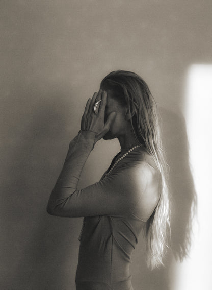 RIVERLAKE moon ring featuring a delicate crescent design with intricate detailing in silver metal.