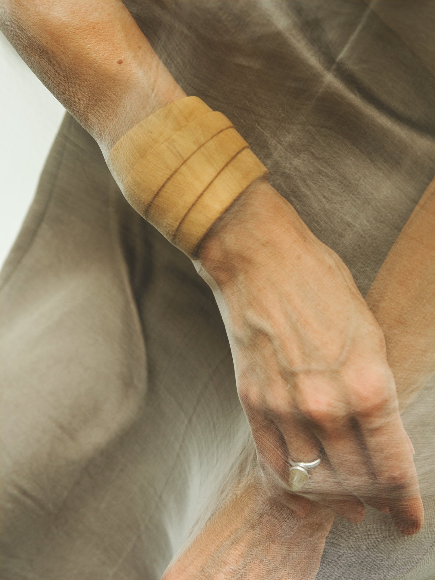 RIVERLAKE Strata Cuff in Boxwood featuring a sleek, modern design with a vibrant green hue and textured finish.