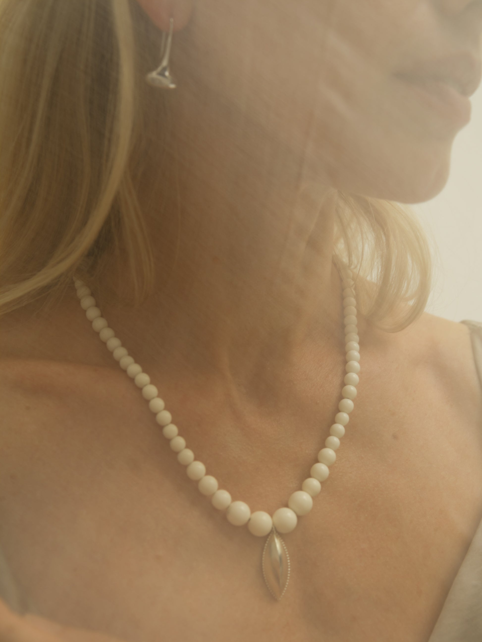 RIVERLAKE Legume Necklace featuring an antler design with intricate detailing and a natural finish.