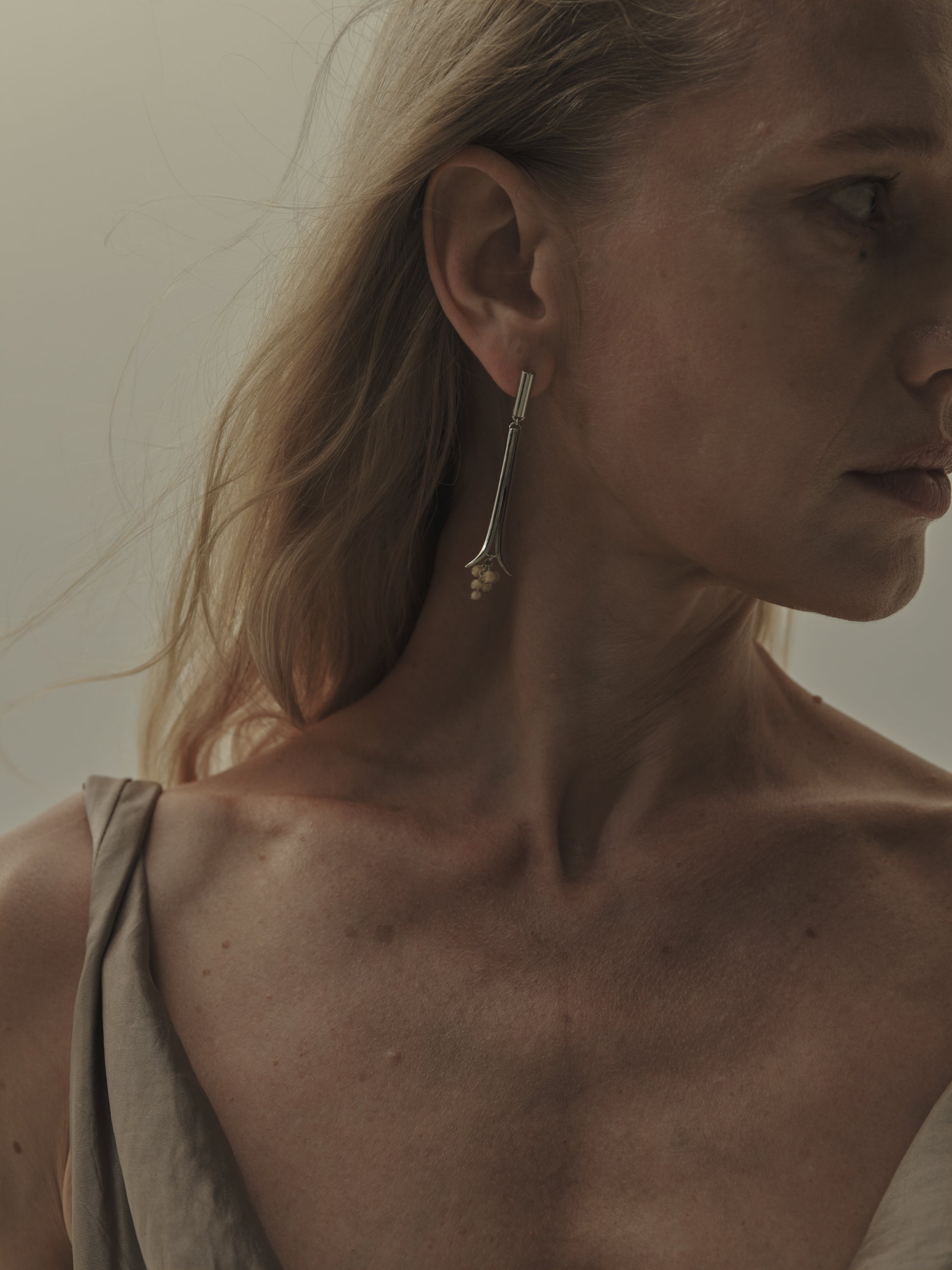 Oasis earrings crafted from natural sheep horn by RIVERLAKE, showcasing a unique, earthy design.