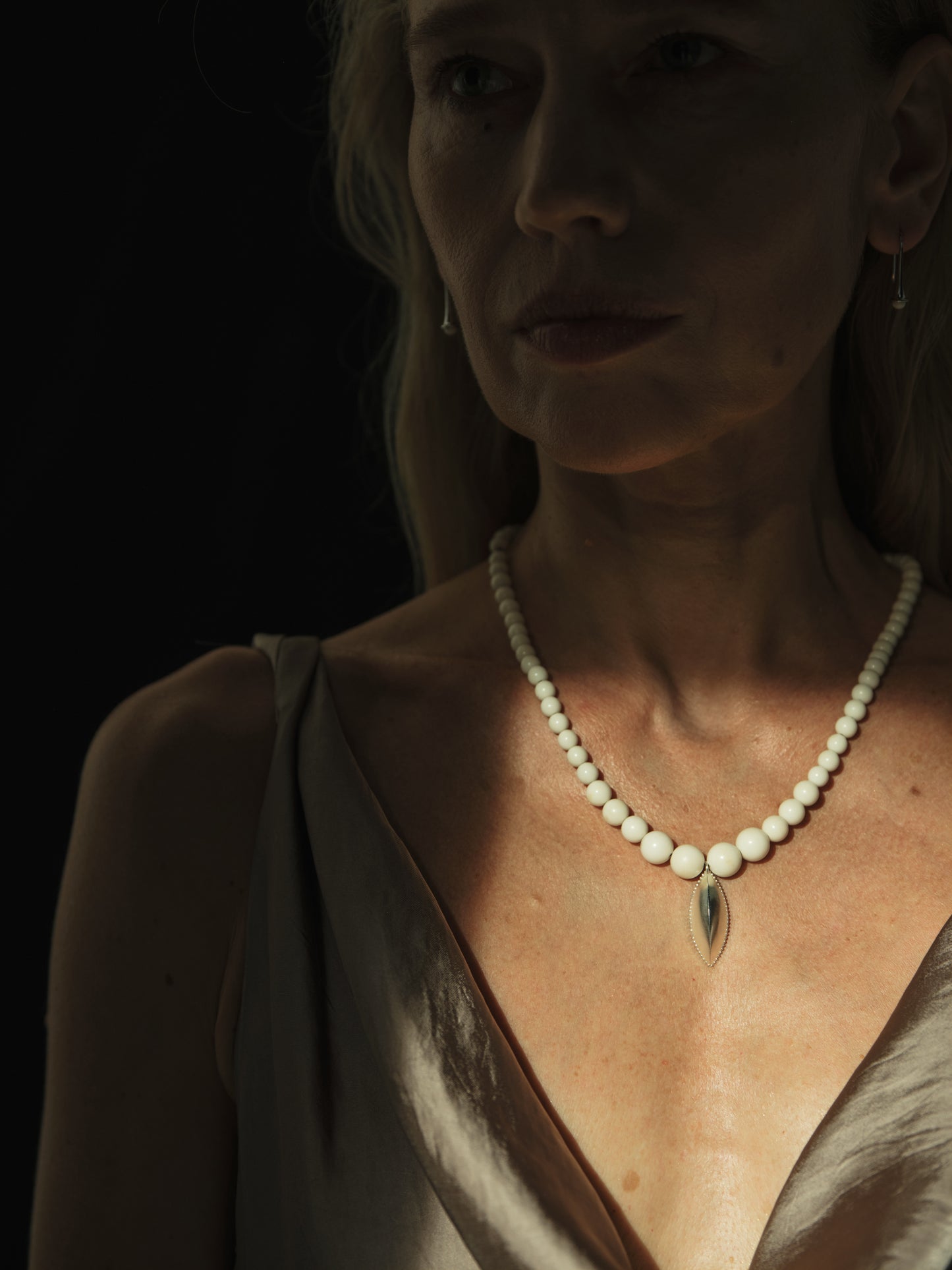 RIVERLAKE Legume Necklace featuring an antler pendant and delicate chain, showcasing a natural and earthy design.