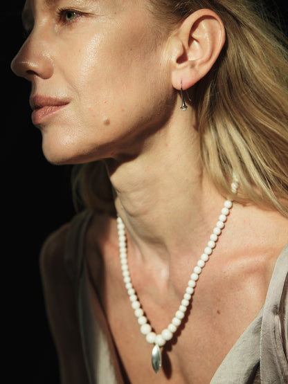 RIVERLAKE Legume Necklace featuring an antler pendant on a delicate chain, showcasing a unique and earthy design.