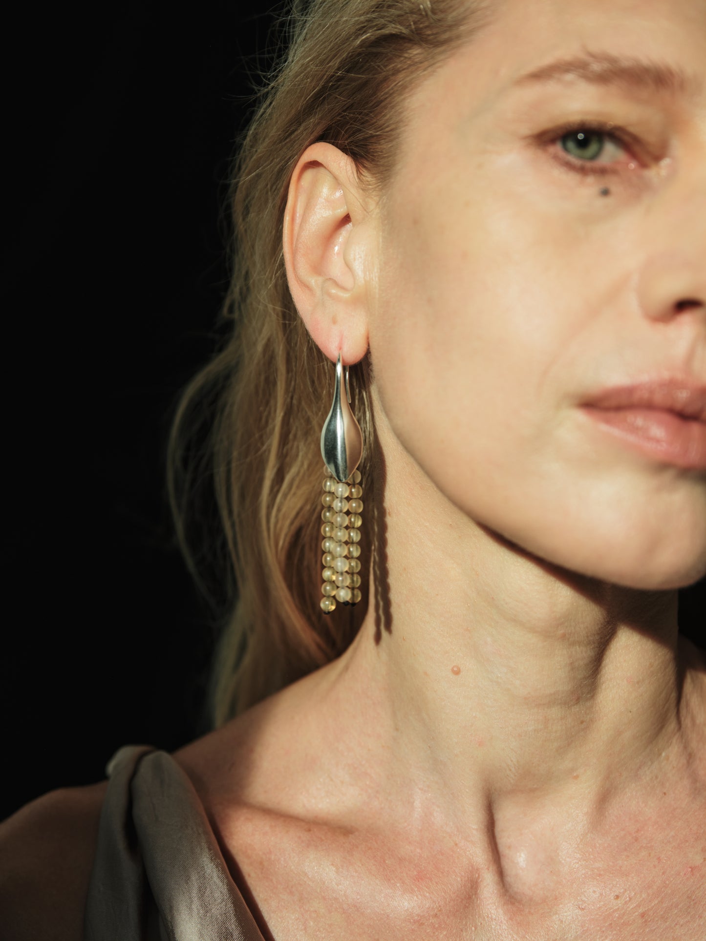 RIVERLAKE Petal Earrings crafted from sheep horn, showcasing an elegant, natural design with a unique texture.