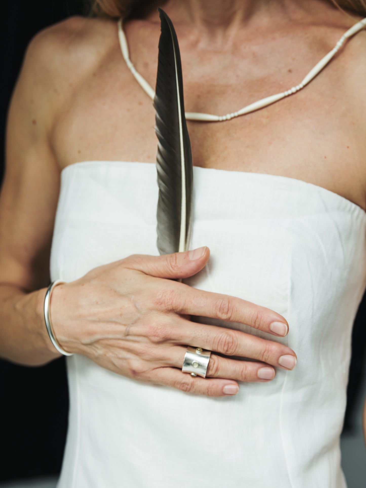 Black buffalo horn pupil ring by RIVERLAKE featuring a smooth, polished finish and a unique, natural design.