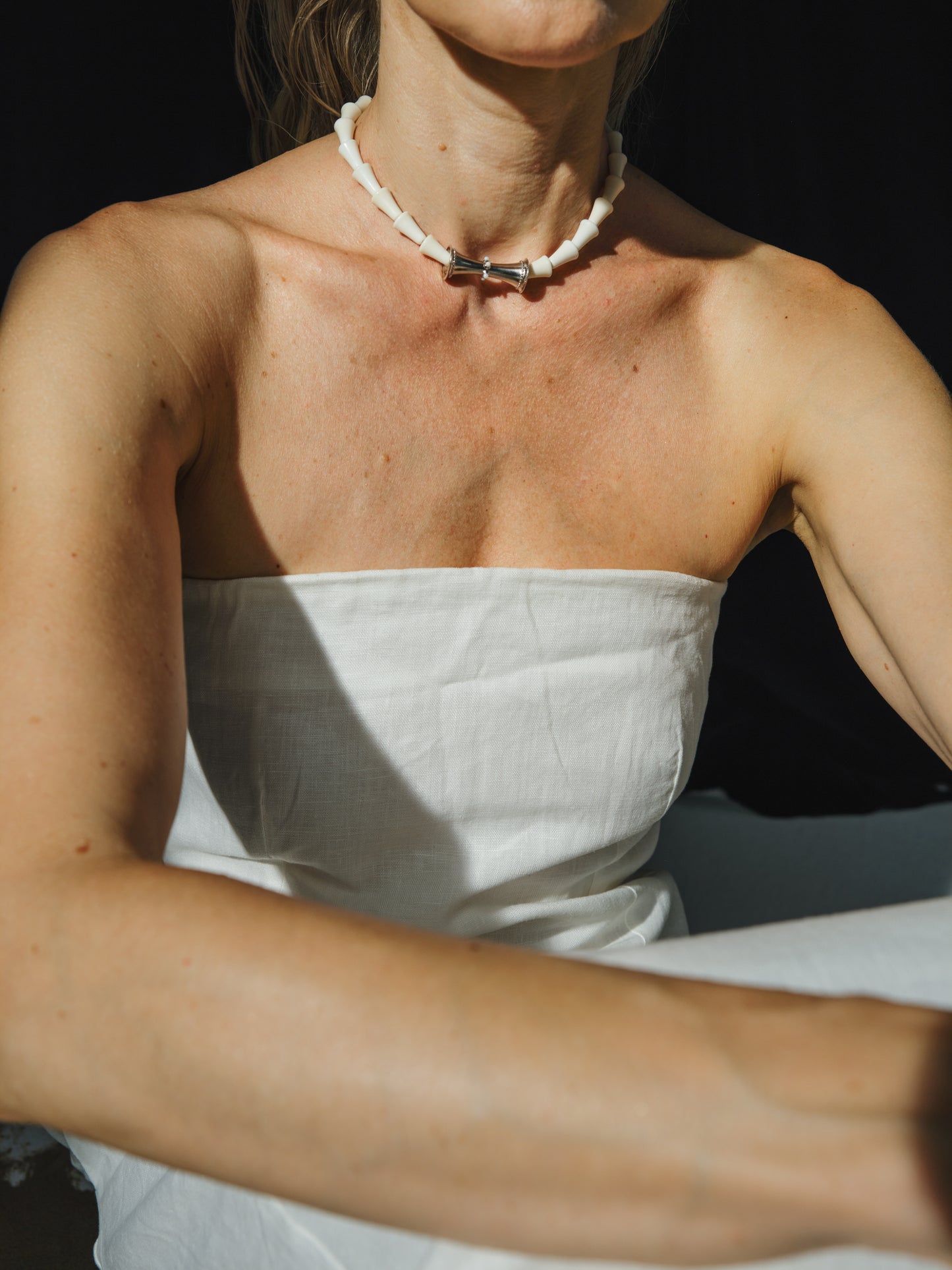 RIVERLAKE cone necklace featuring an antler design, elegantly hanging from a delicate chain.