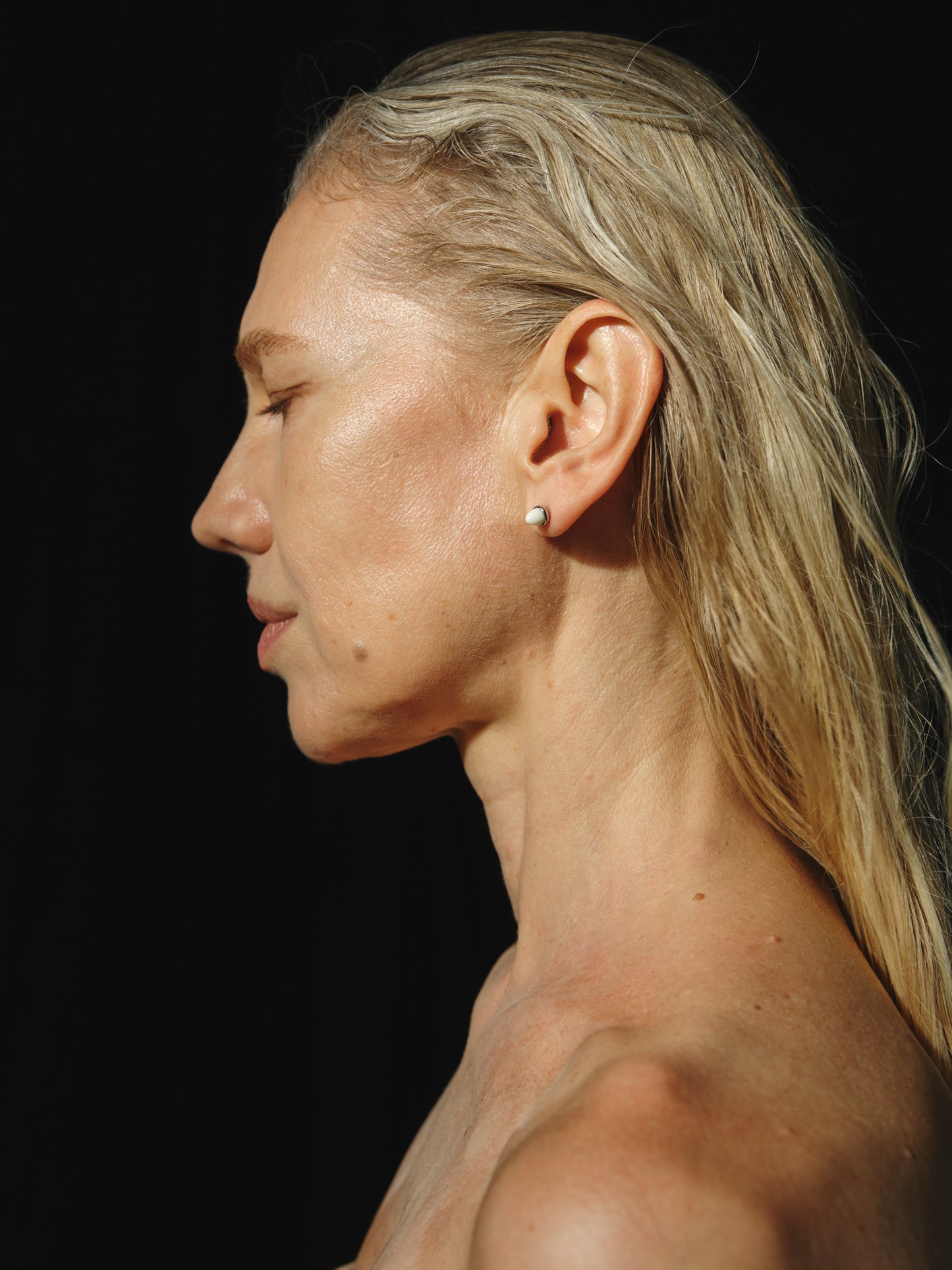 Ox bone teeth studs by RIVERLAKE, showcasing intricate design and natural color variations.