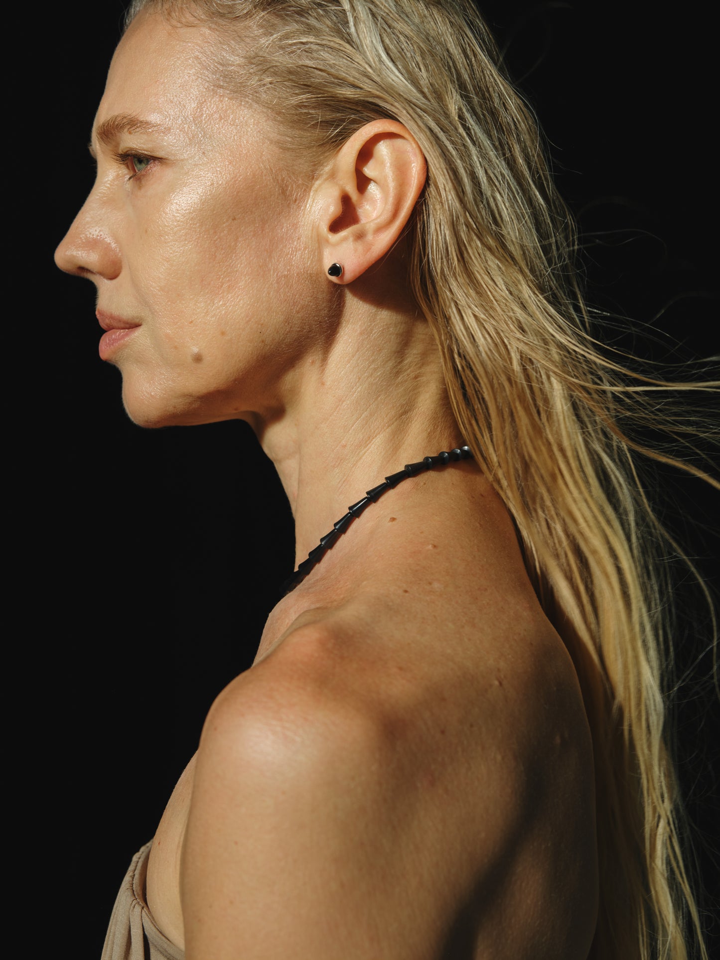 Simple cone necklace made of black buffalo horn by RIVERLAKE, showcasing a sleek and modern design.