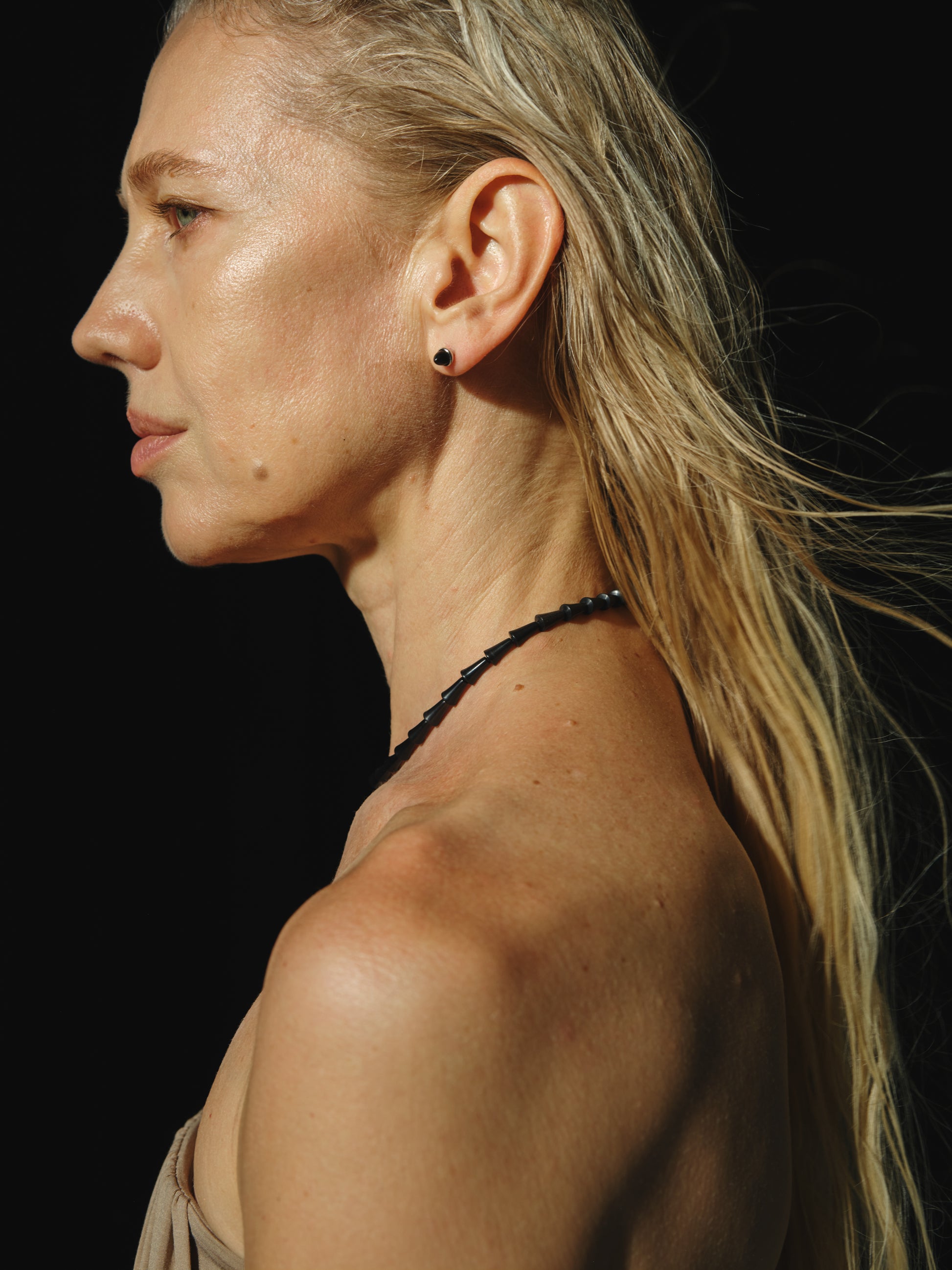 Simple cone necklace made of black buffalo horn by RIVERLAKE, showcasing a sleek and modern design.