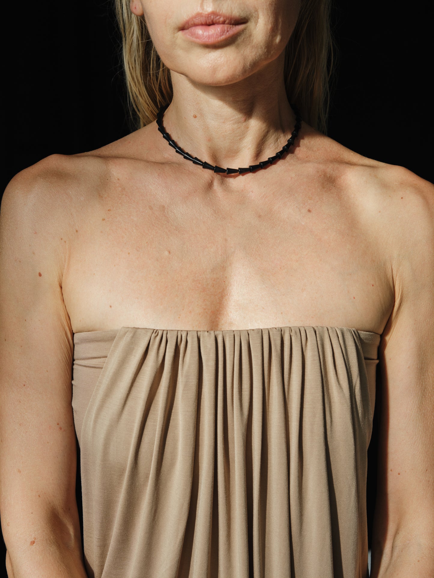 Black buffalo horn simple cone necklace by RIVERLAKE, showcasing a sleek, modern design with a smooth finish.