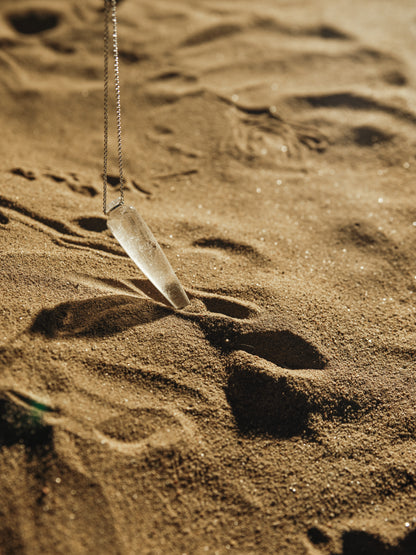 Phial of Light pendant necklace featuring a clear quartz stone by RIVERLAKE, elegantly suspended on a delicate chain.