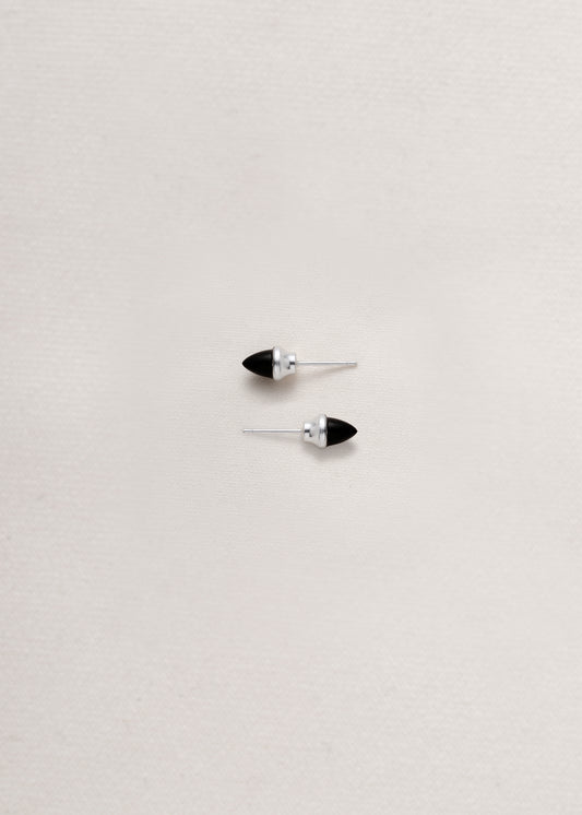 Black buffalo horn teeth studs by RIVERLAKE, featuring a sleek design and natural finish.