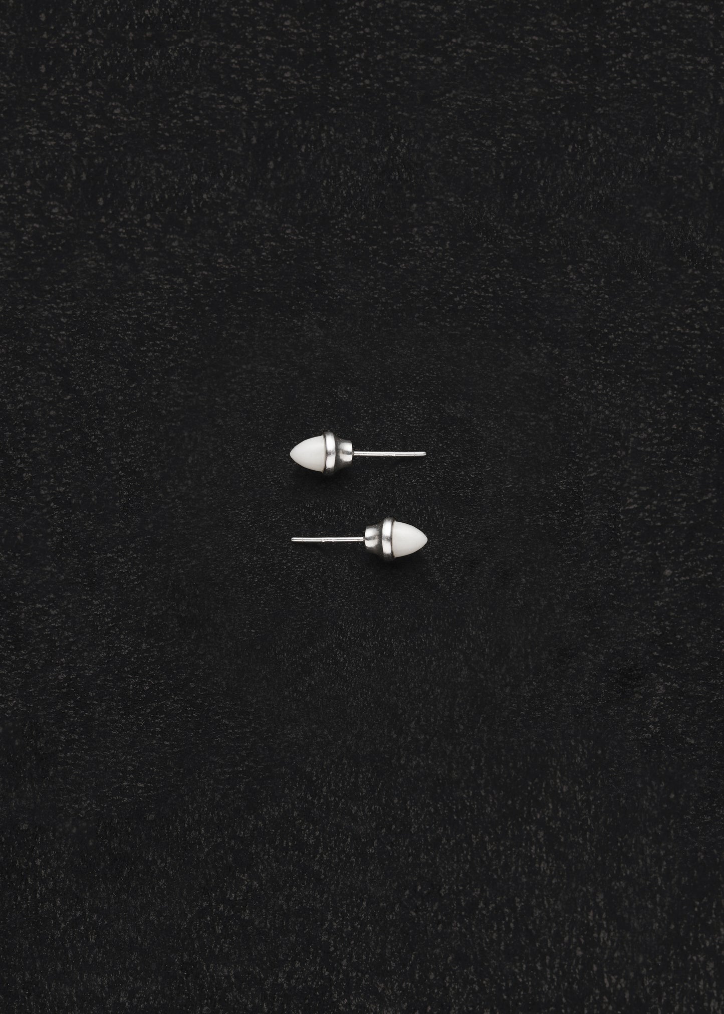 RIVERLAKE Ox Bone Teeth Studs showcasing intricate design and natural texture in a white finish.