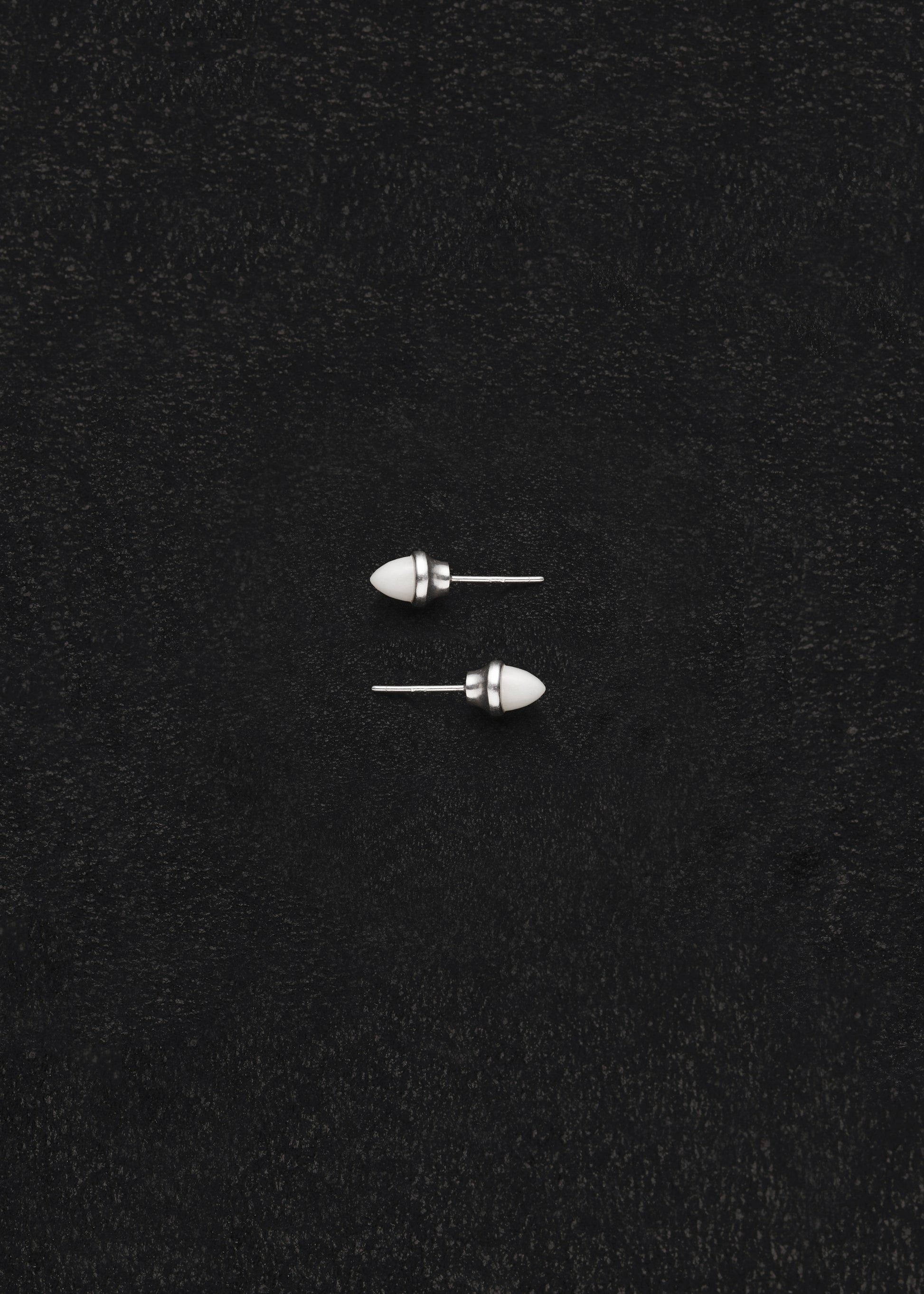 RIVERLAKE Ox Bone Teeth Studs showcasing intricate design and natural texture in a white finish.