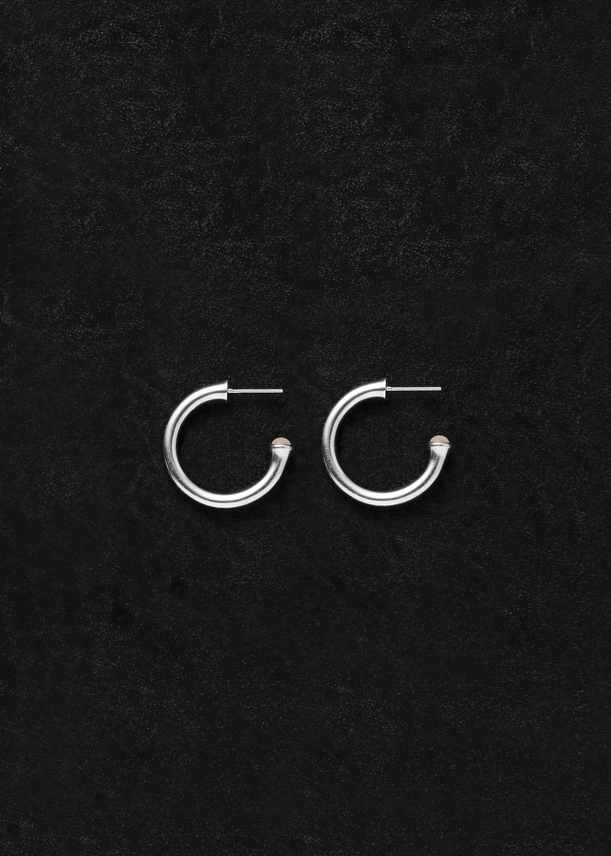 Small yellow buffalo horn signature hoops by RIVERLAKE, featuring a sleek, modern design perfect for everyday wear.