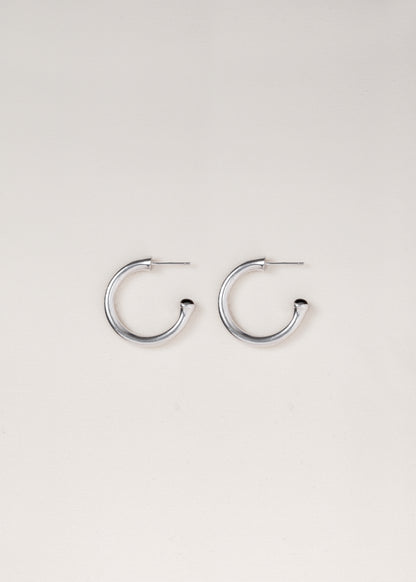 Small black buffalo horn signature hoops by RIVERLAKE, showcasing a sleek and modern design.