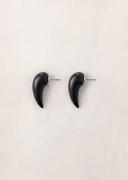 Medium fang earrings made of black buffalo horn by RIVERLAKE, showcasing a sleek, modern design.