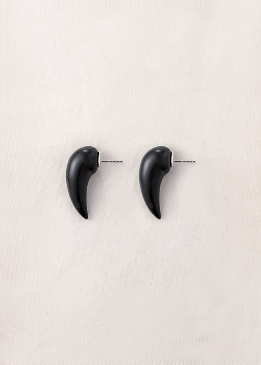 Medium fang earrings made of black buffalo horn by RIVERLAKE, showcasing a sleek, modern design.