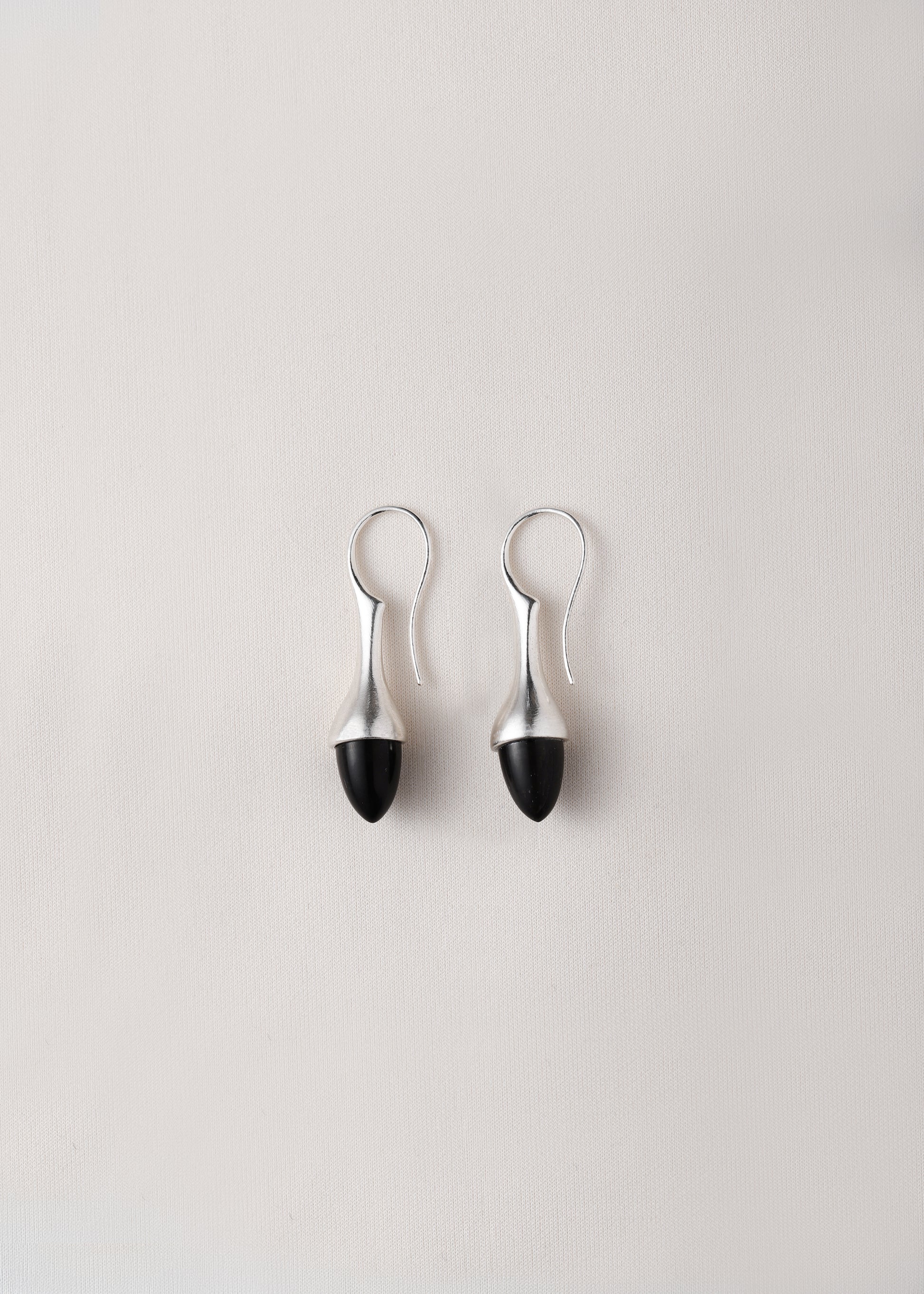 Black buffalo horn Dewdrop earrings by RIVERLAKE, showcasing a unique, elegant design with a glossy finish.